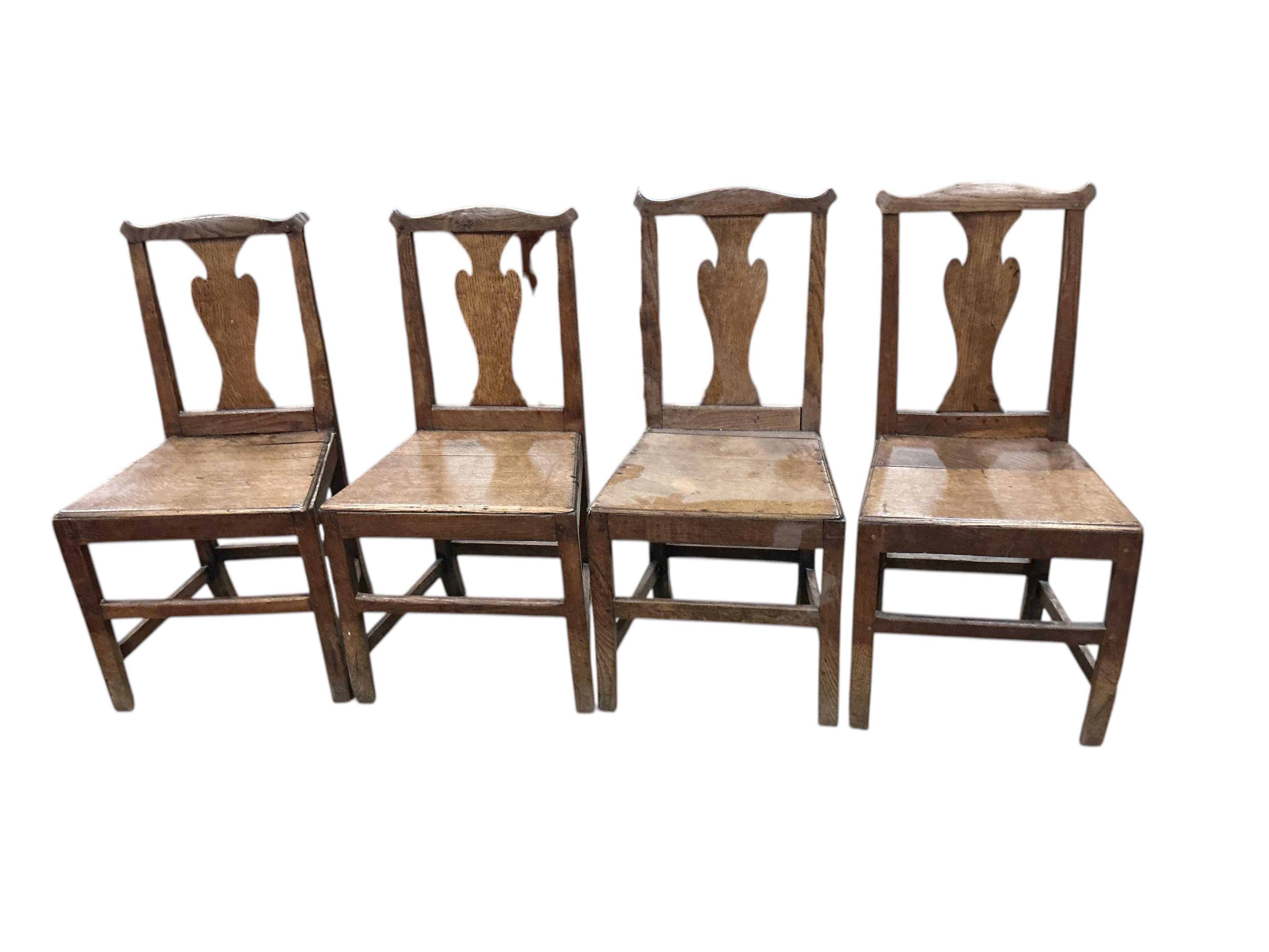 A harlequin set of six George III Provincial oak wood seat dining chairs